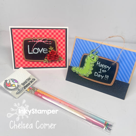 Two handmade greeting cards displayed on a light gray background, along with a packaged set of colored pencils and a small branded card. The left card has a red-and-white gingham border with a dark brown chalkboard-style center reading 'Love' and a red rose.