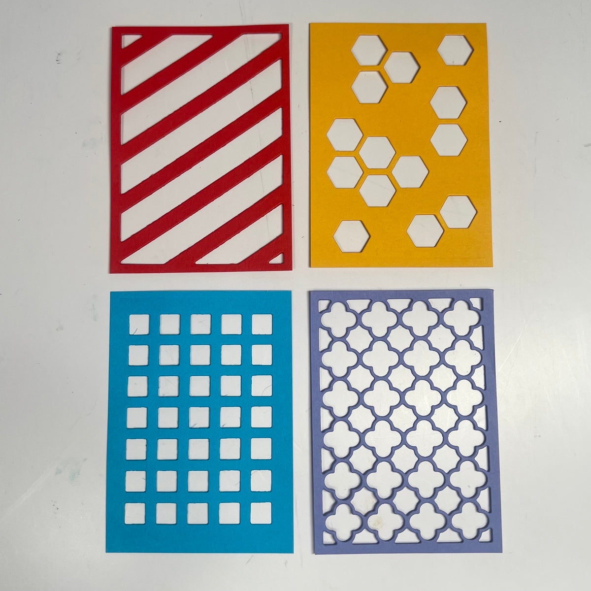 Frameworks Dies by InkyStamper make great die cut backgrounds.  They are ATC sized but can be repeated to make larger backgrounds.