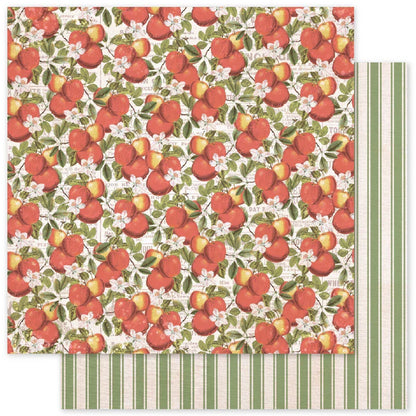 A sheet of patterned paper with a dense print of red apples, green leaves, and small white flowers, layered over a second sheet with vertical sage green and cream stripes.