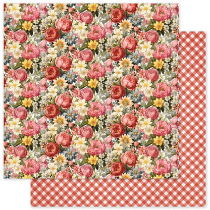 Two square sheets of patterned paper shown overlapping on a white background. The top sheet features a dense floral print with pink, red, yellow, and white flowers on a light background.