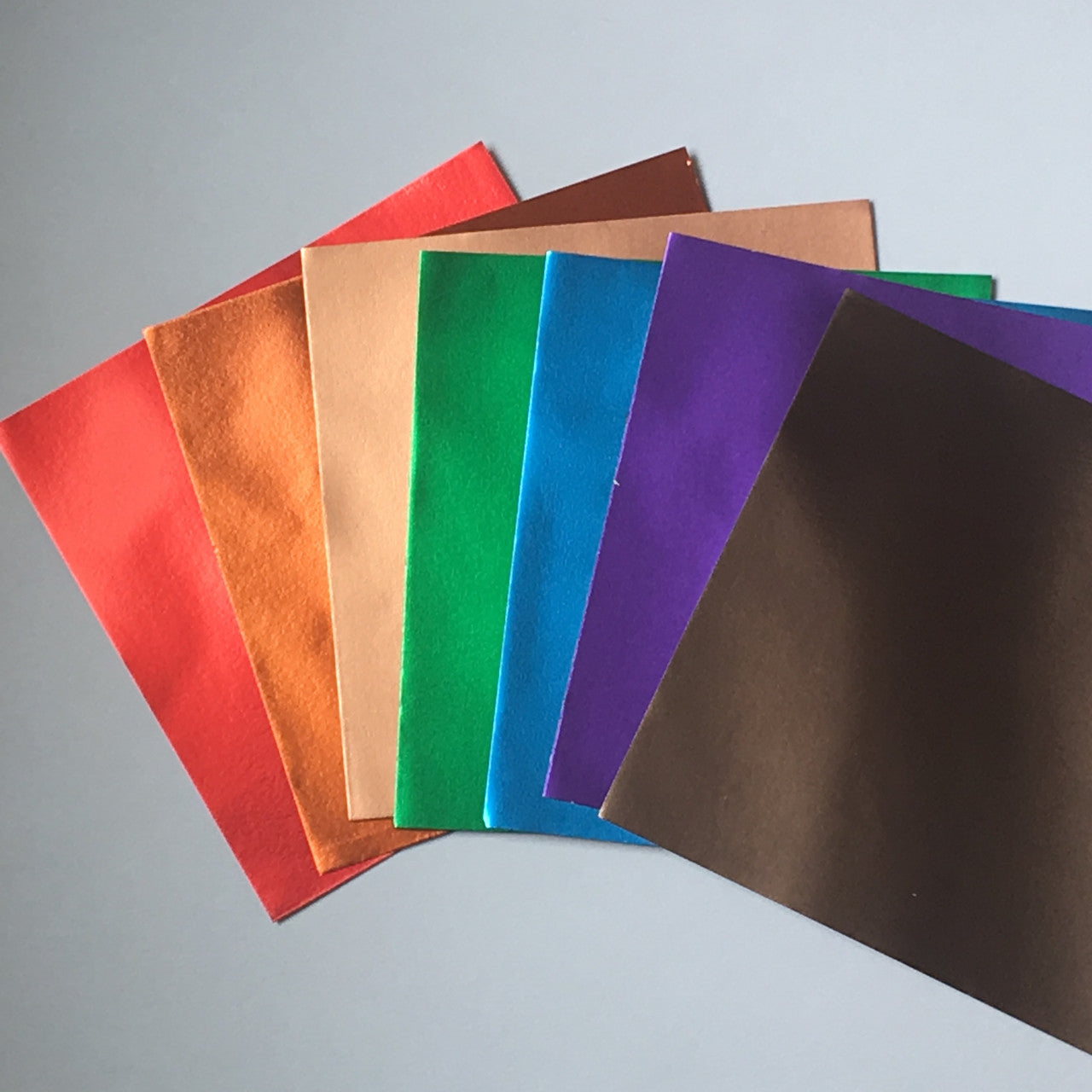 7 Luxurious Colors of Metallic Paper with Gold on the back of every piece.  6" x 6"